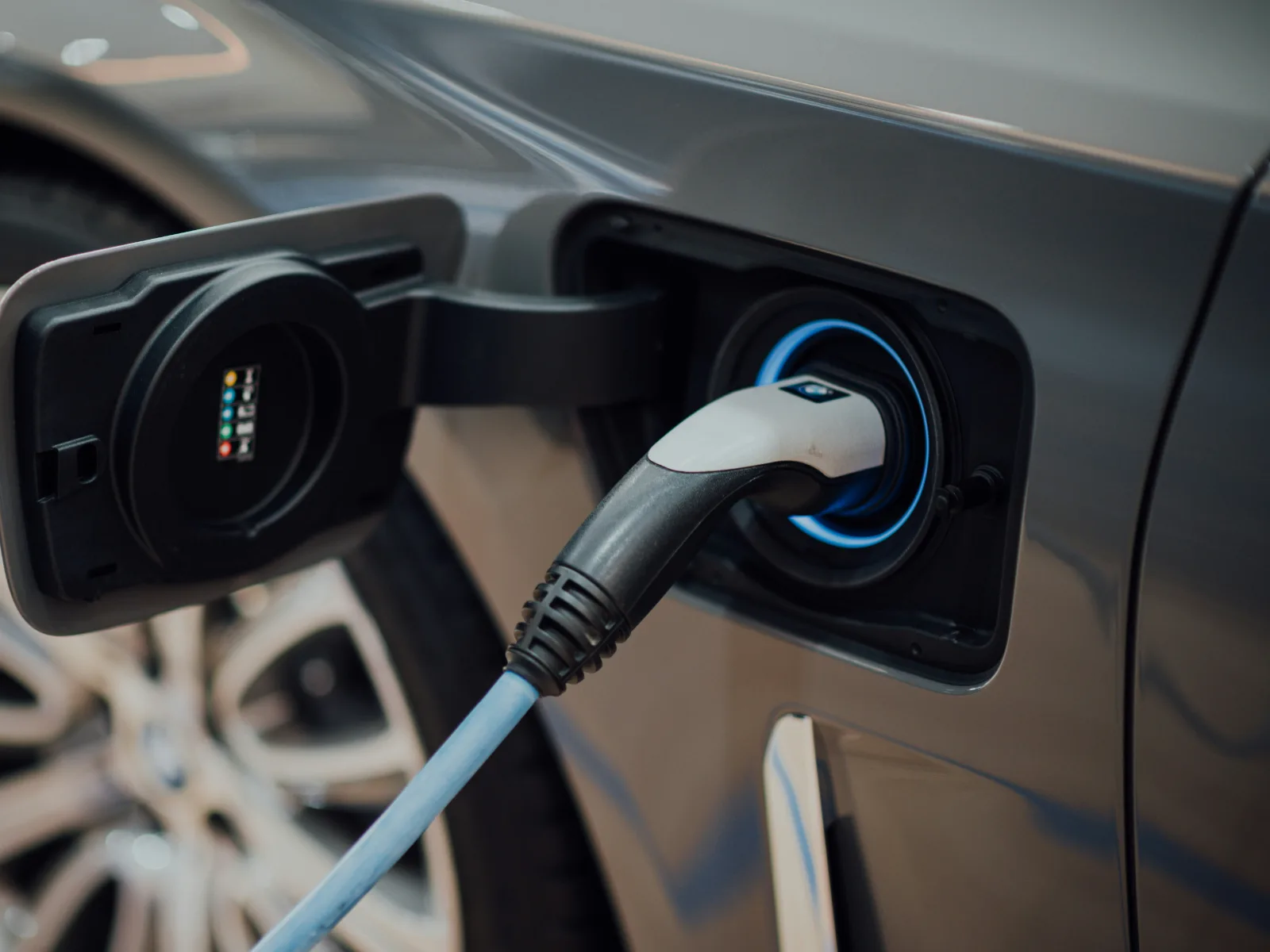 Electric car plugged in to a home charger